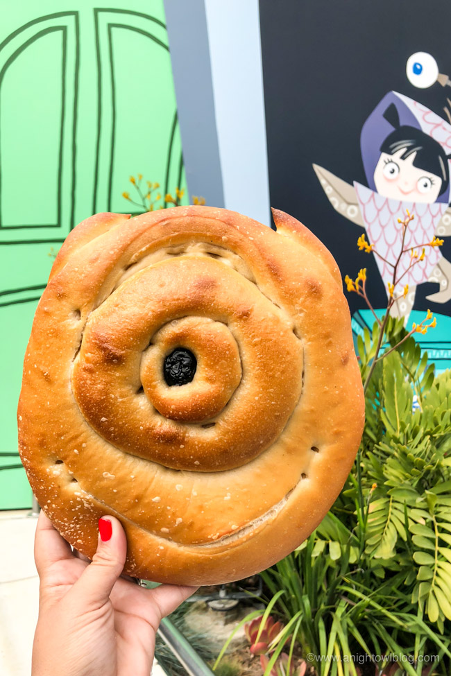 Mike Wazowski Shaped Bread, Disney California Adventure Park, Pacific Wharf | From Cheeseburger Pizza from Alien Pizza Planet to the Toy Story Root Beer Float in a Souvenir Boot, check out our picks for The BEST Disneyland Pixar Fest Food finds! #Disneyland #PixarFest